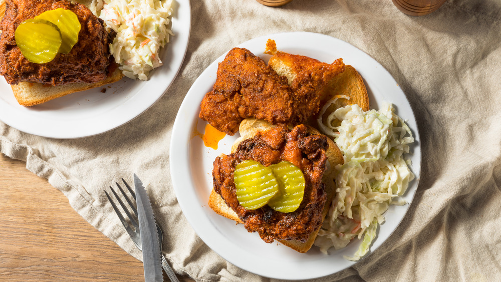 Plates with Nashville hot chicken and sides