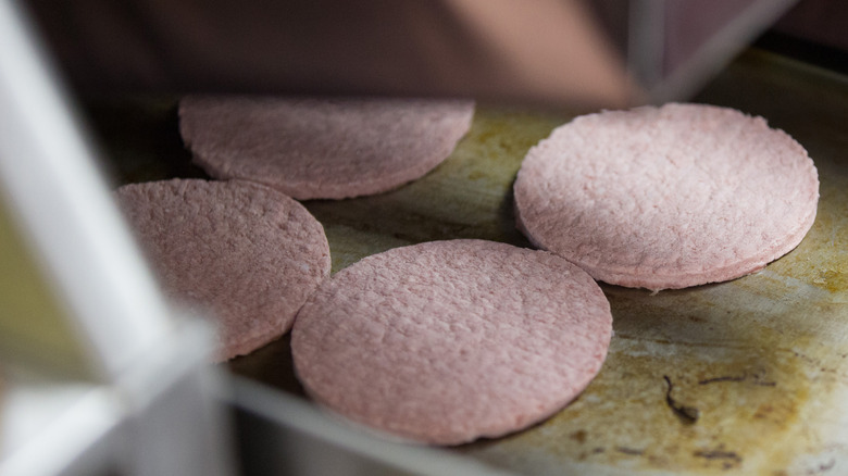 McDonald's patties on grill