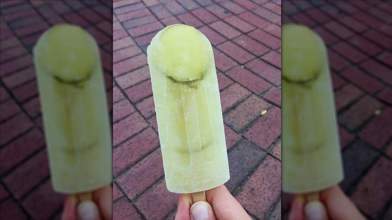 holding pickle popsicle
