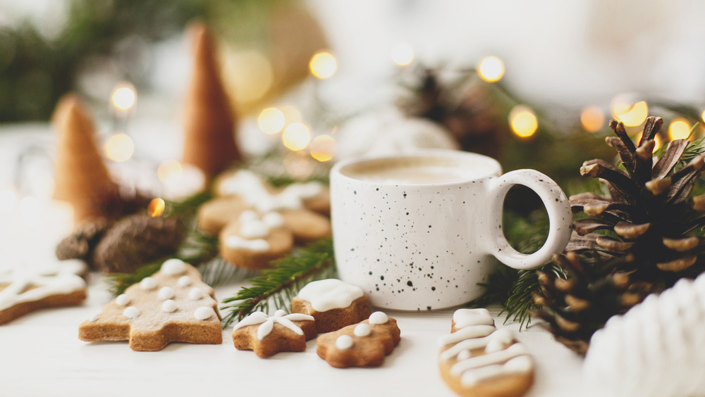 cookies and warm mug with winter decor