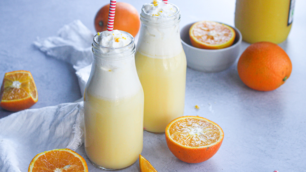 orange julius in glass bottles with striped straws