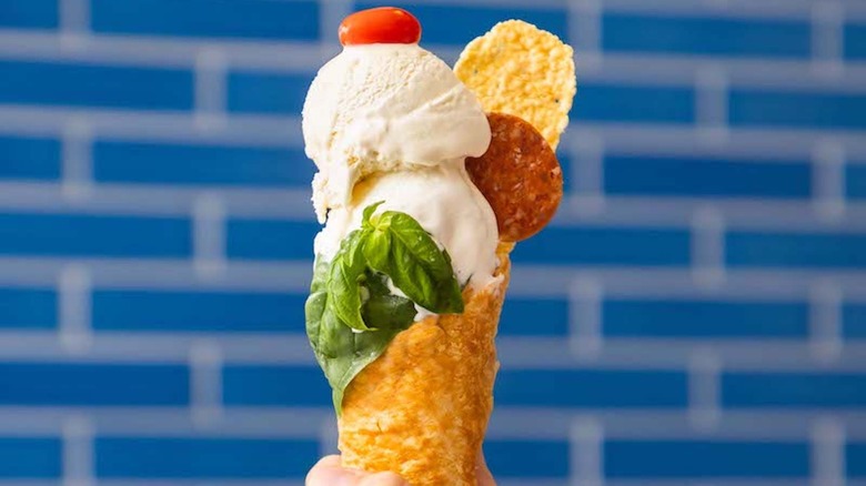 DiGiorno croissant crust ice cream cone against blue tile wall