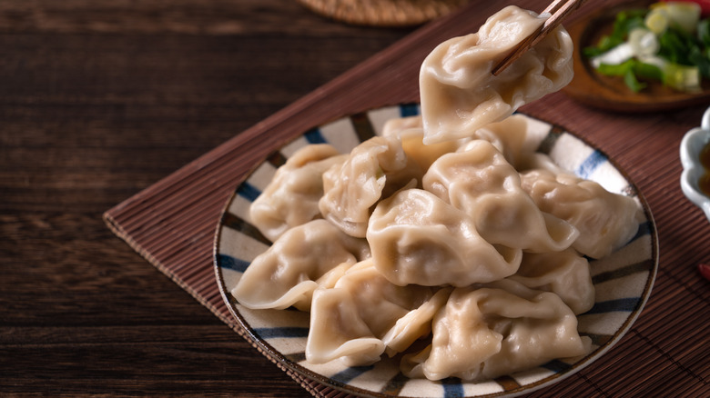 chopstick grabbing Chinese boiled jiaozi
