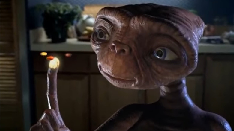 Reese's pieces orbiting around E.T.'s finger