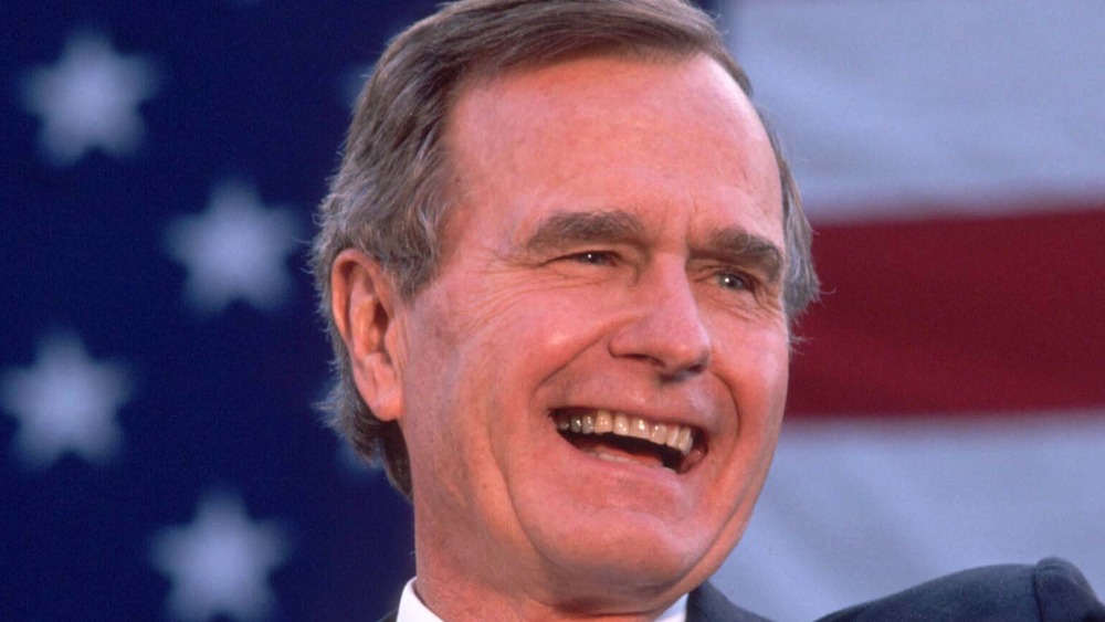 President George H.W. Bush wearing black suit