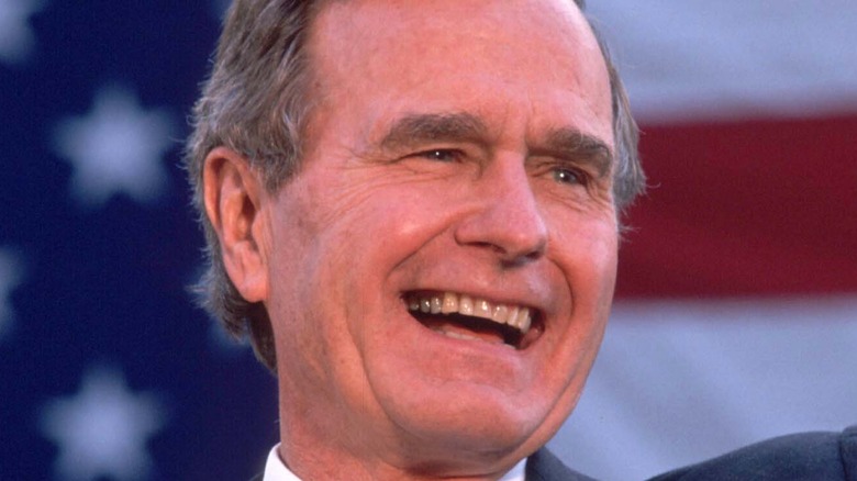 President George H.W. Bush wearing black suit