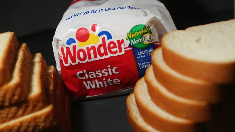Package of Wonder Bread next to slices of bread