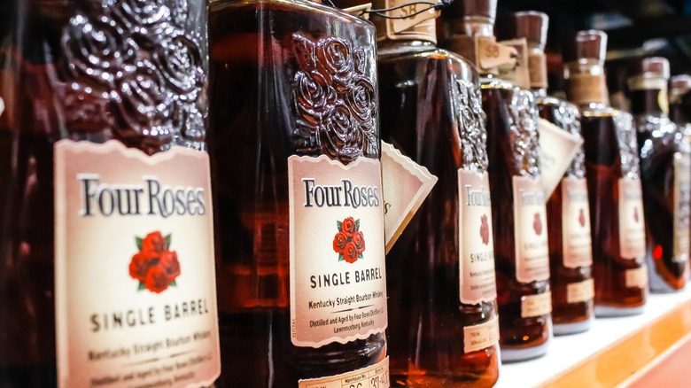 Row of Four Roses Single Barrel Bourbon bottles