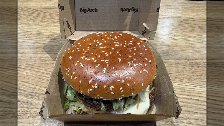 McDonald's new Big Arch burger in box on table.