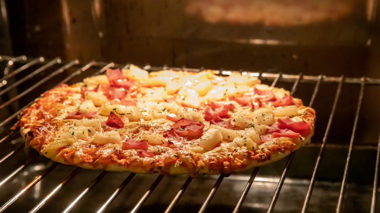 Frozen pizza in oven