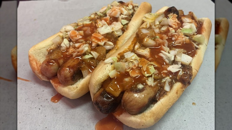 Two double hot dogs from the Roast Grill with sauce and slaw