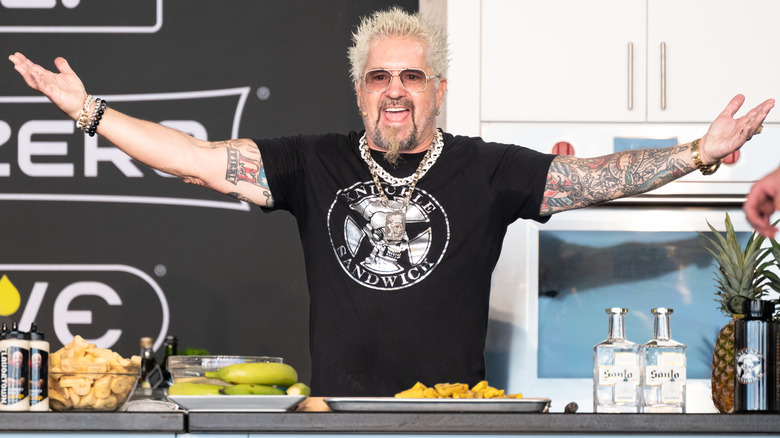 Guy Fieri onstage during his cooking demo at the 2026 South Beach Wine & Food Festival.