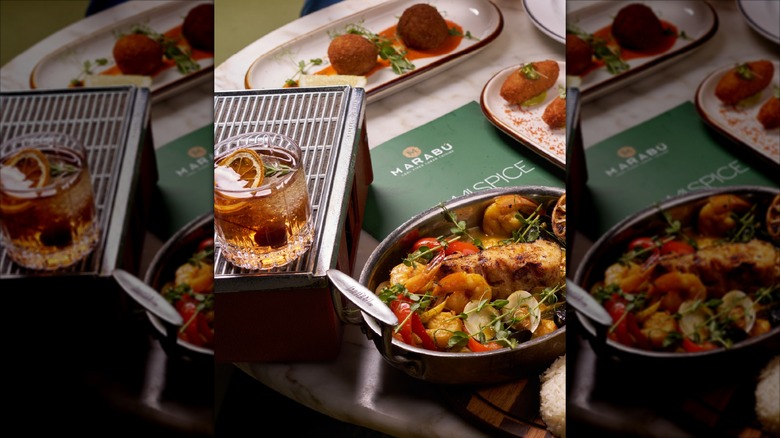 assorted dishes at Marabu restaurant with menu on the table
