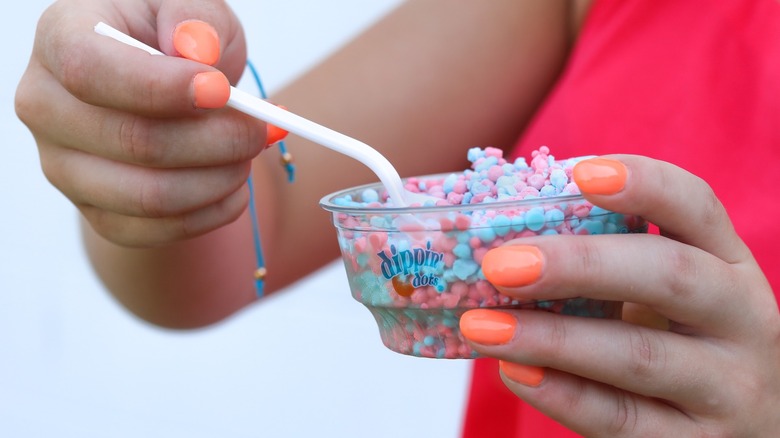 woman spooning dippin' dots