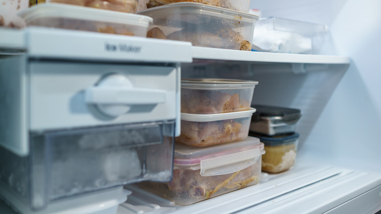 Ice maker inside freezer with full shelves