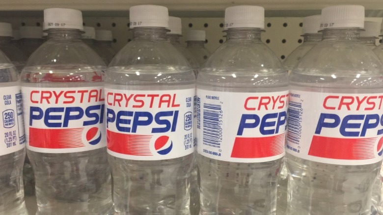 Bottles of Crystal Pepsi on shelf