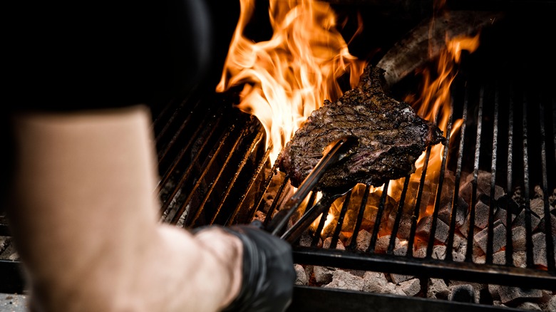 A steak coming off the grill