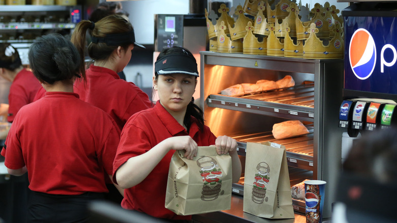 Burger King employees behind counter