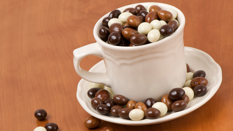 chocolate covered espresso beans in coffee cup