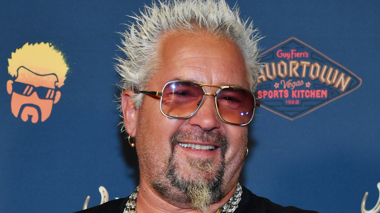 Guy Fieri against blue background