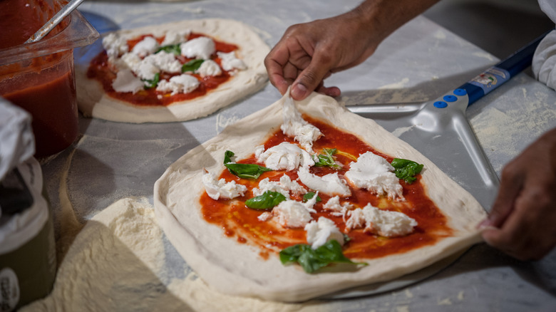  pizza on a pizza peel