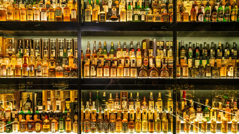 Bottles of Scotch and other liquor on multi-tiered bar