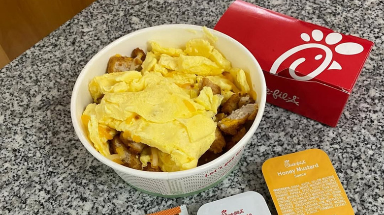 chick fil a breakfast bowl with eggs and honey mustard