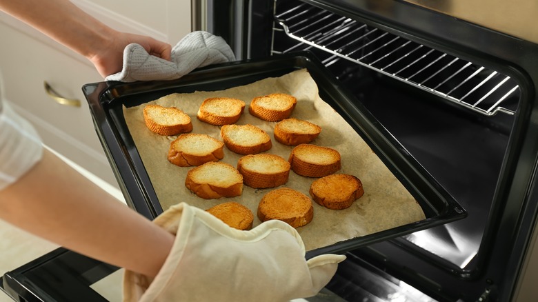 toast on parchment paper in pan