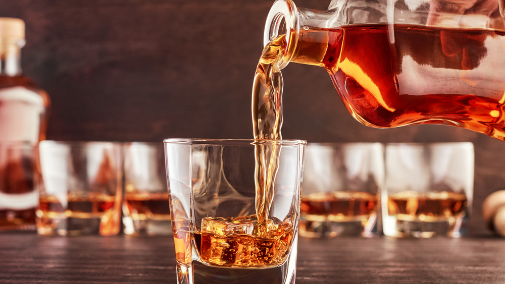 Whiskey being poured into a glass