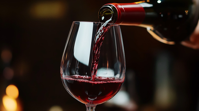 Glass of wine being poured