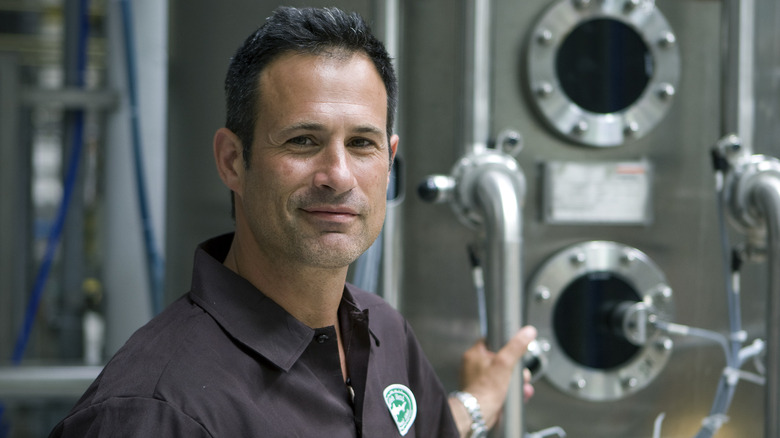 Sam Calagione poses with brewing equipment