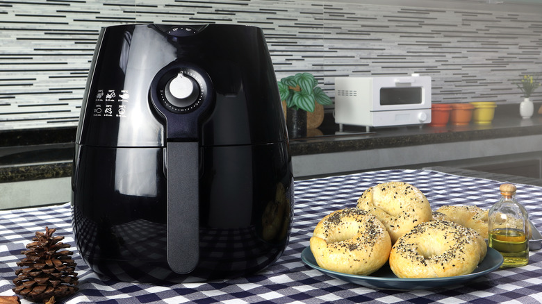 Air fryer in kitchen with bagels