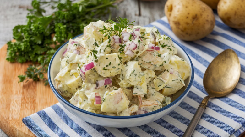 Bowl of potato salad with onion