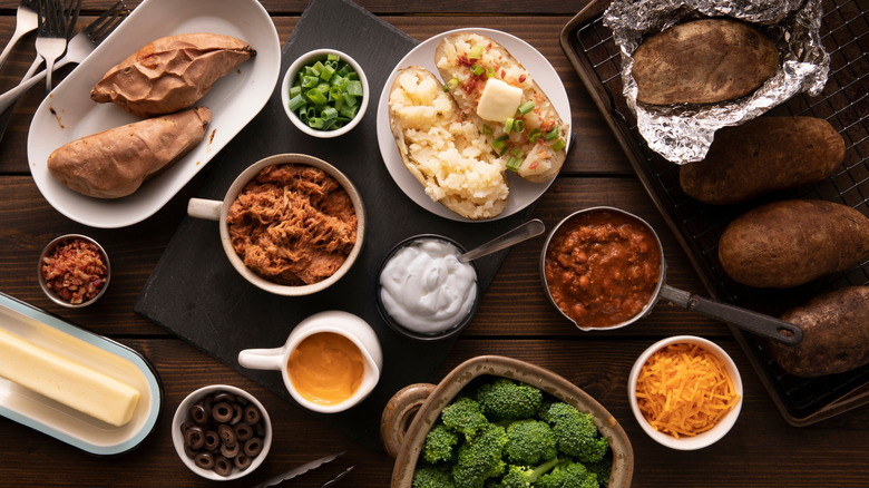 Baked potato with assorted condiments