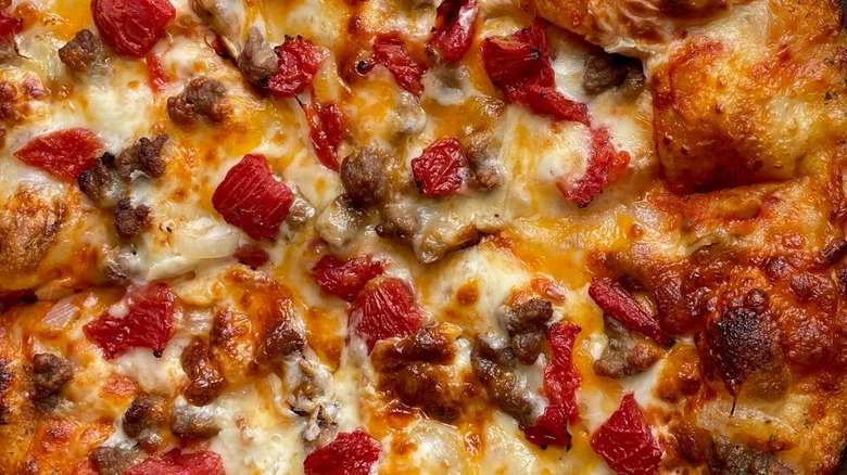 Close-up of Domino's cheeseburger pizza