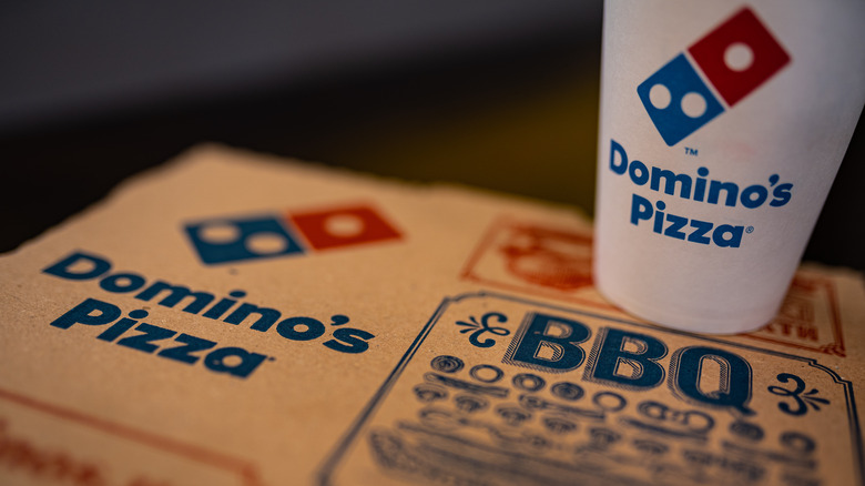 Domino's pizza box and white cup