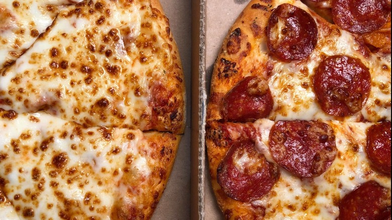 cheese and pepperoni pizzas