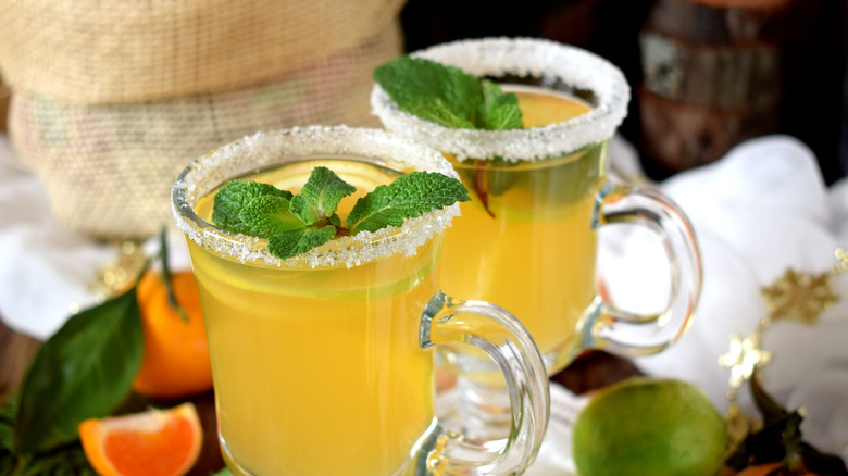 hot toddy garnished with citrus and mint