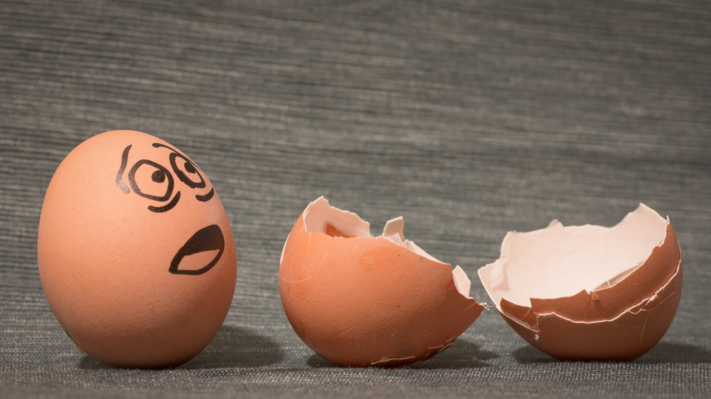 Cracked egg with a face on it