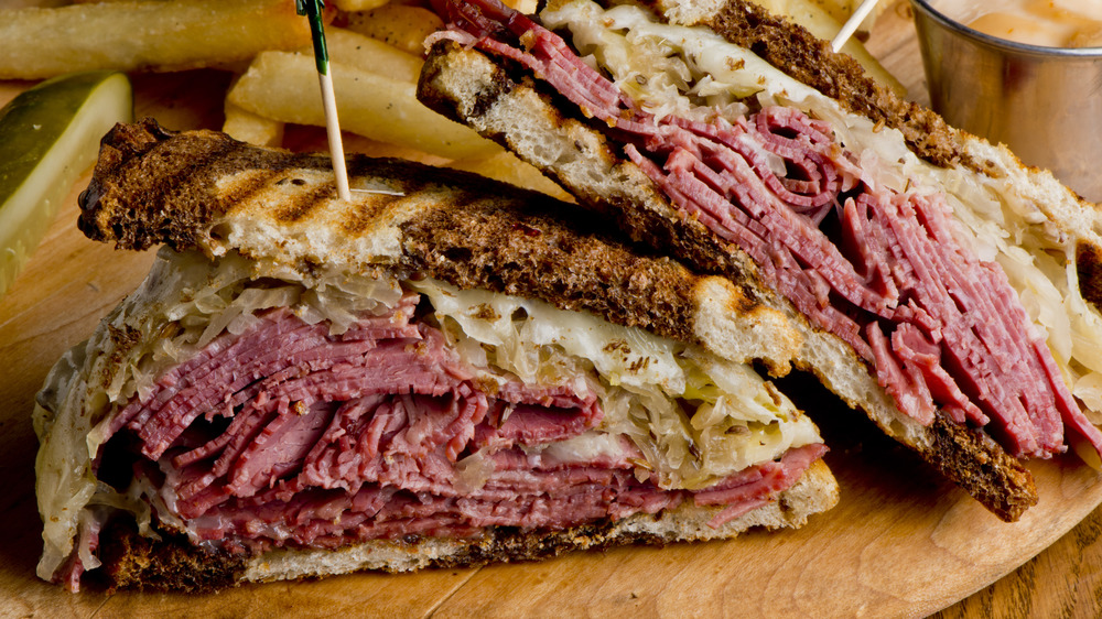Pastrami reuben on a cutting board