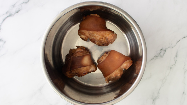 ham hocks in a metal pot
