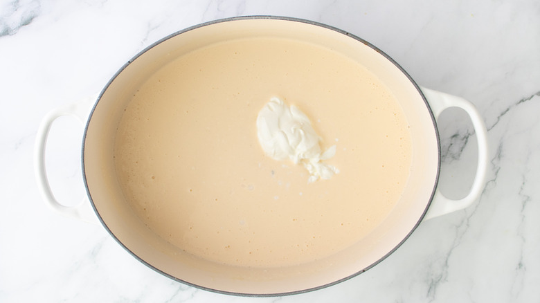 pale orange liquid in a white pot