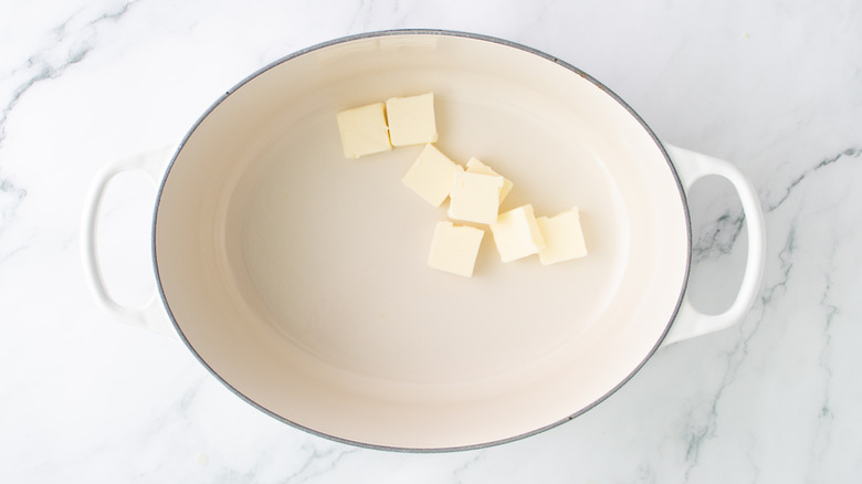 butter chunks in a white pot