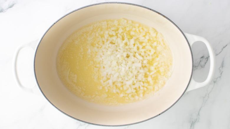 onions and melted butter in a white pot