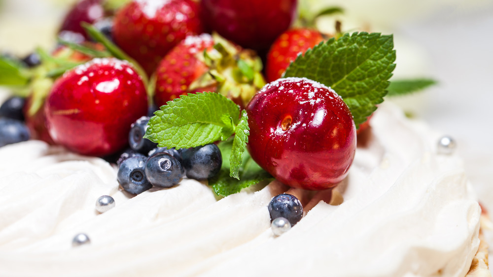 Pavlova with fresh cream and berries