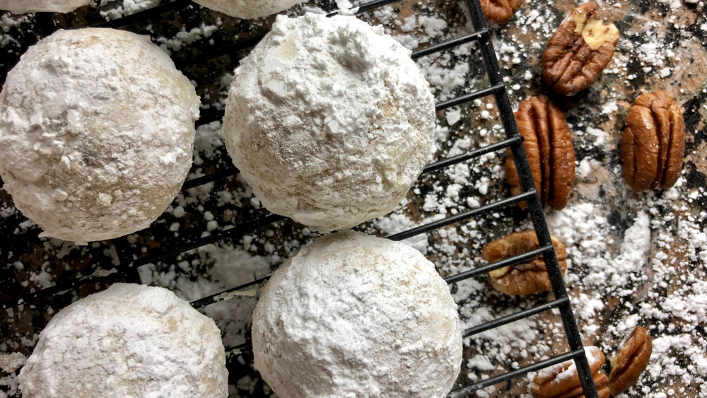 Mexican wedding cookies on cooling rack