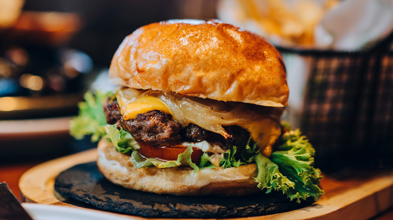 A cheeseburger on a platter
