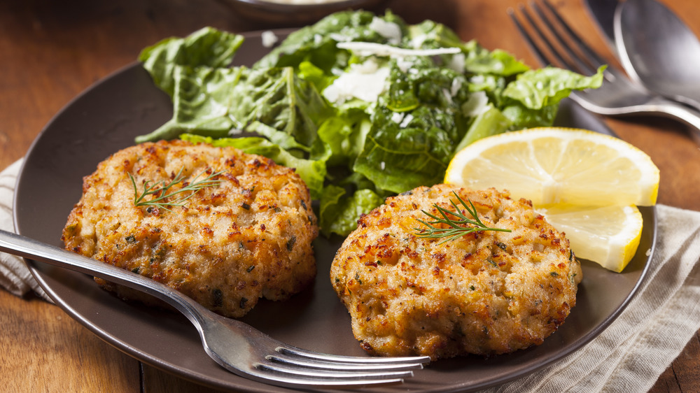 Homemade crab cakes with lemon wedge