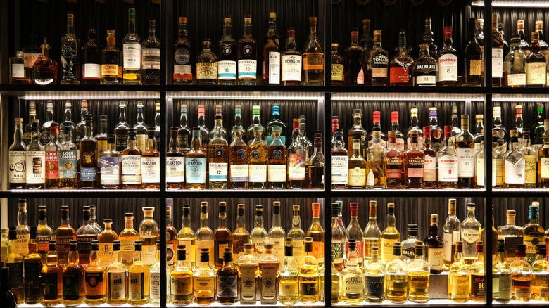 whiskey bottles on bar