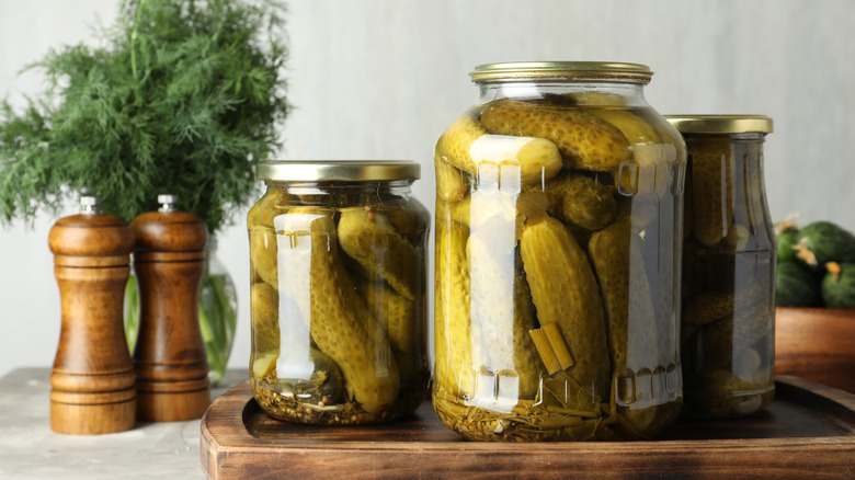 Pickle jars with seasonings nearby